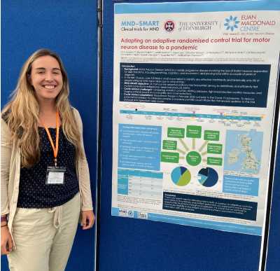 Amy Stenson standing with her poster
